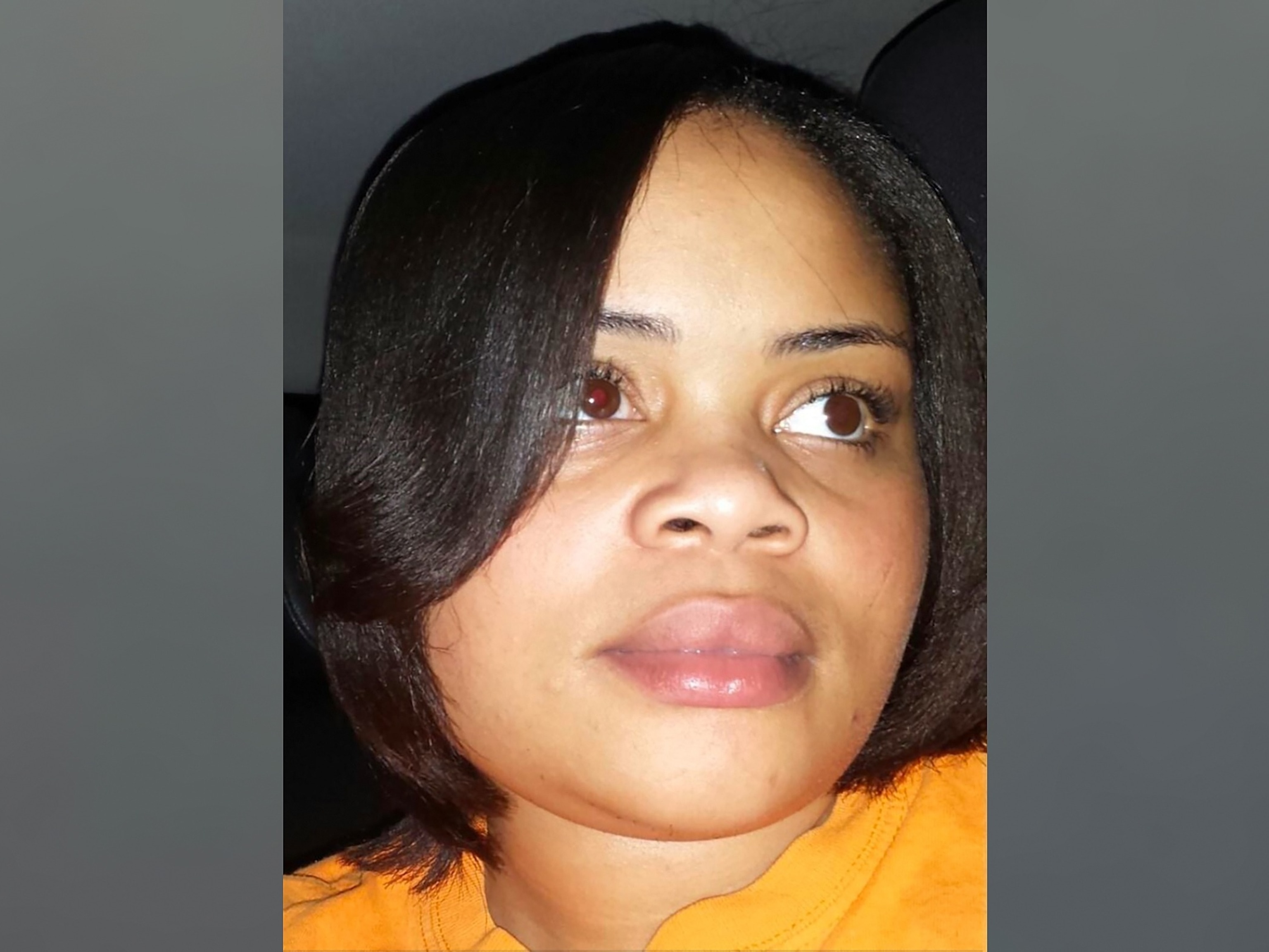 Atatiana Jefferson wearing a yellow shirt